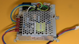 A MeanWell RD-35A as replacement. Mains and output wiring is cleanly separated.