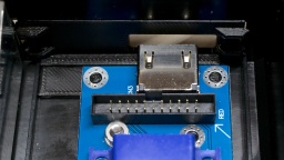 A holder keeps the HDMI board in place and prohibits that it pivots around the screw.