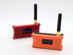 The LoRa32 sender and receiver in their case.