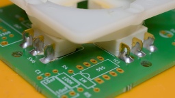 The four switches are soldered to the upper side of the PCB. You can use wire brackets for additional securing.