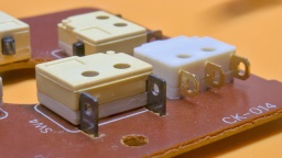 Left: The original microswitch. Right: The Saia-Burgess F4T7GPUL, with shorter solder tails.