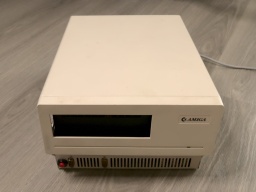 Front view of the A1060 Sidecar, but with a gaping hole where the floppy drive is supposed to be.