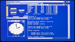 MS-DOS in one window, Amiga Workbench and Clock in other windows.
